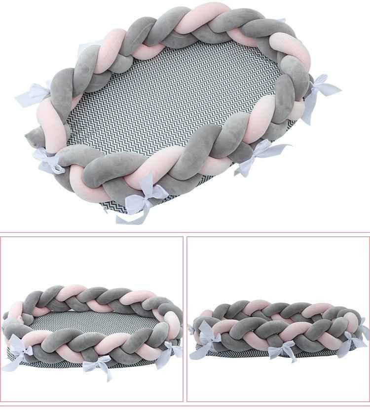 Gray braided baby nest bed bottom view showing protective base and secure construction