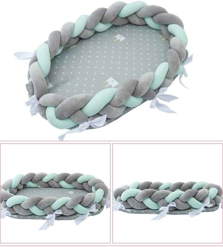 Gray olive braided baby nest bed top view with size measurements and dimensions included